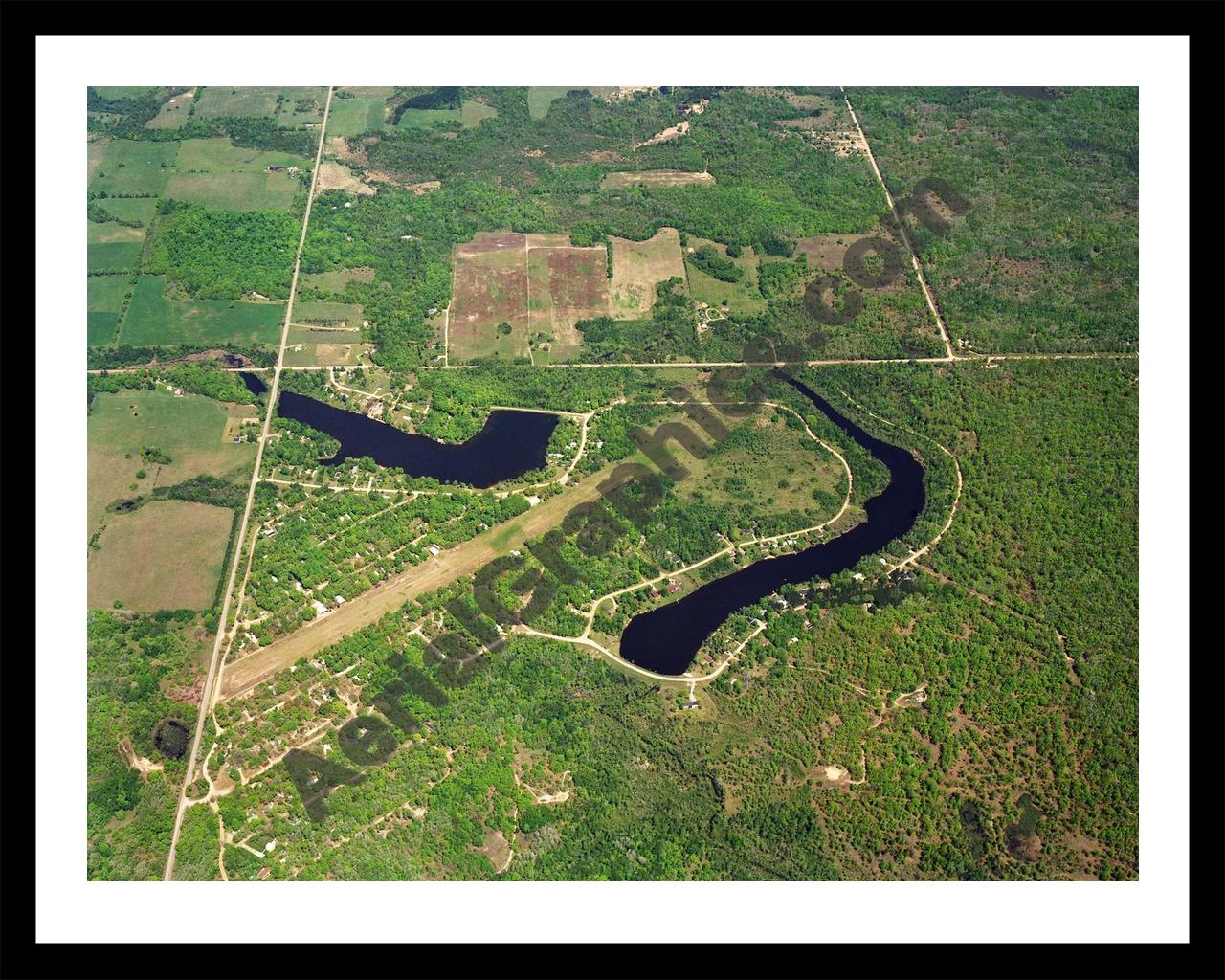 Aerial image of [5701] Lake Windaga in Isabella, MI with Black Metal frame