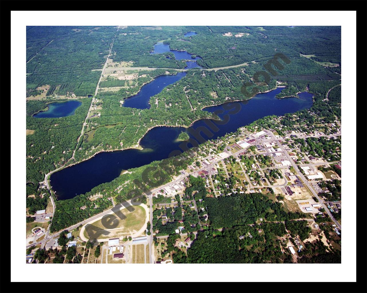 Aerial image of [5722] Budd Lake in Clare, MI with Black Metal frame