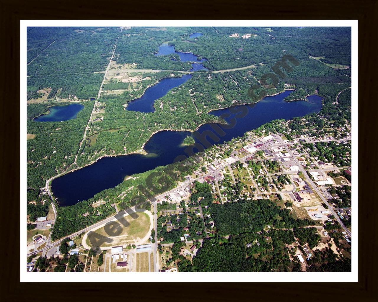 Aerial image of [5722] Budd Lake in Clare, MI with Black Wood frame