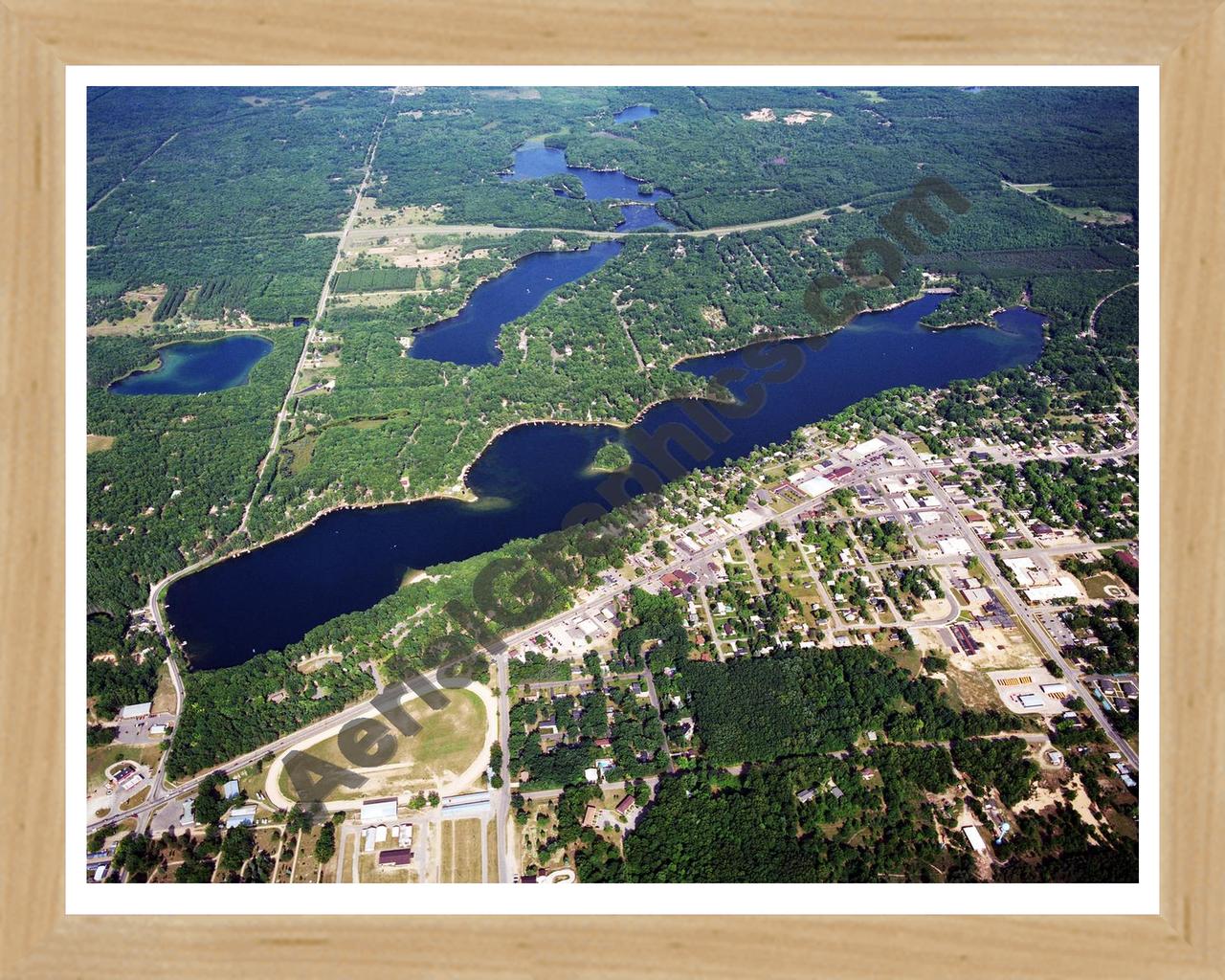 Aerial image of [5722] Budd Lake in Clare, MI with Natural Wood frame