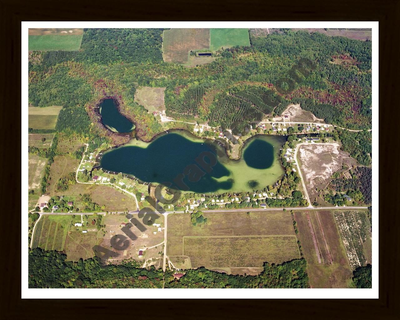 Aerial image of [5741] Crooked Lake in Montcalm, MI with Black Wood frame