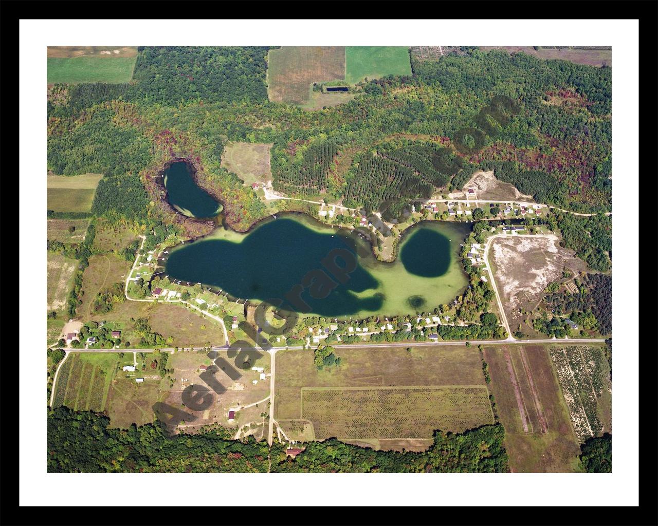 Aerial image of [5741] Crooked Lake in Montcalm, MI with Black Metal frame