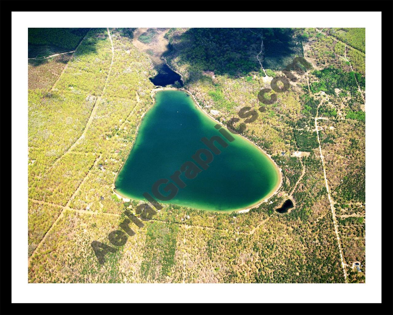 Aerial image of [5751] Douglas Lake in Otsego, MI with Black Metal frame