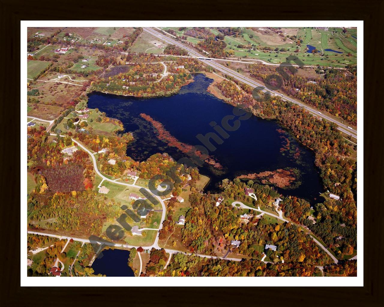 Aerial image of [5761] Eliza Lake in Oakland, MI with Black Wood frame