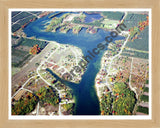 Aerial image of [5784] Lake Gitchegumee in Wexford, MI with Natural Wood frame