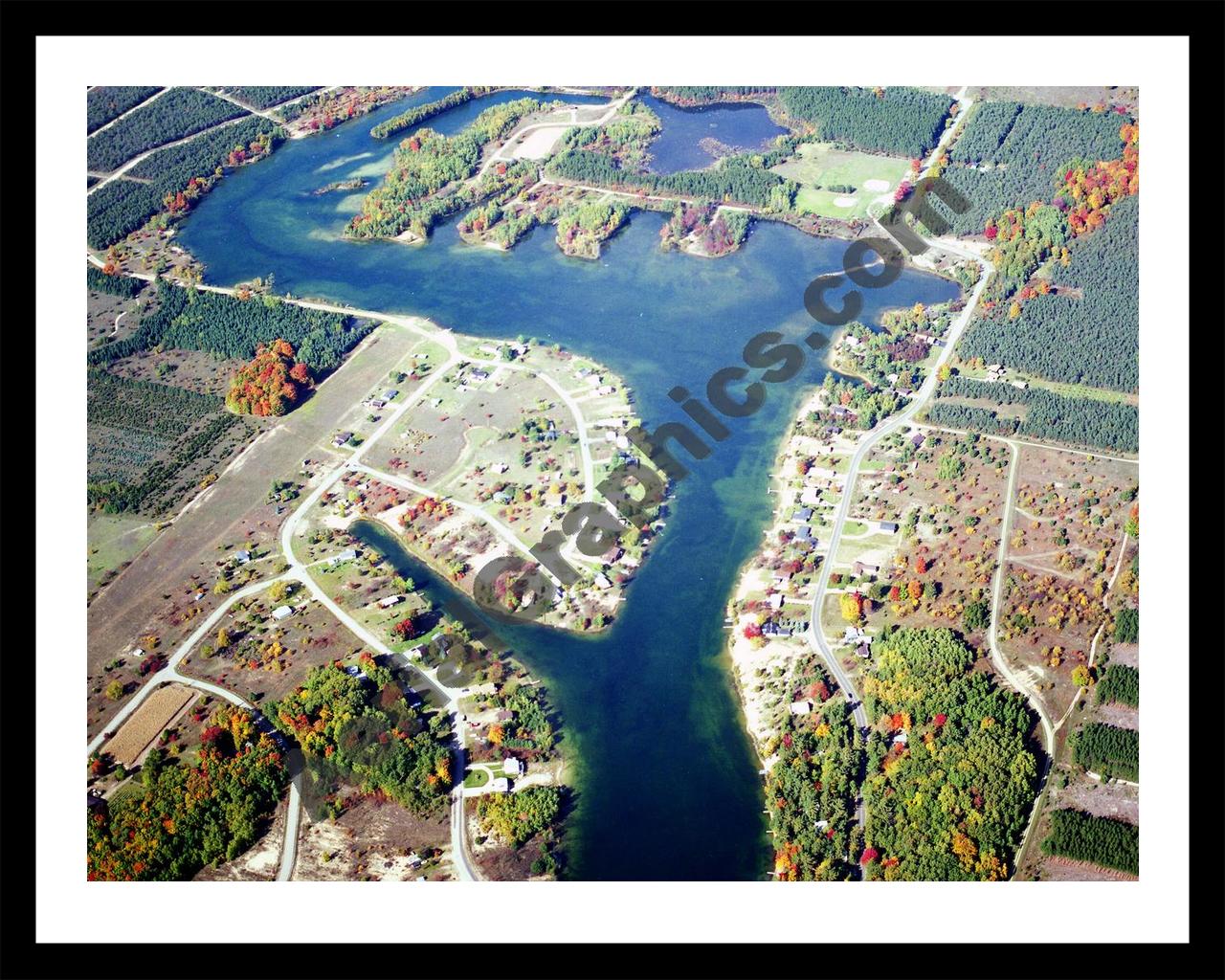 Aerial image of [5784] Lake Gitchegumee in Wexford, MI with Black Metal frame