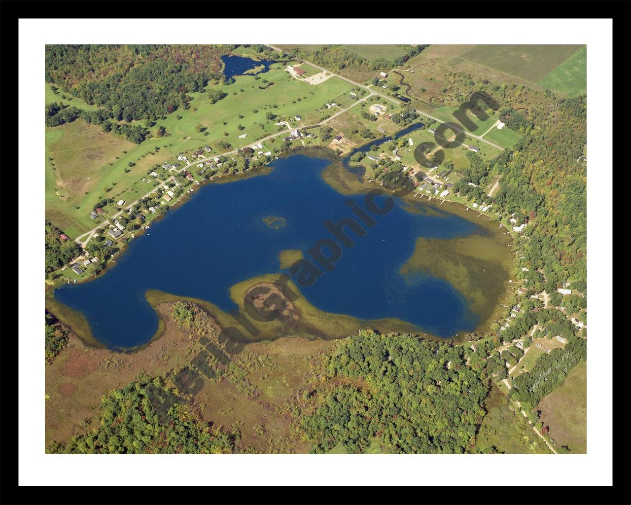 Aerial image of [5804] Holland Lake in Montcalm, MI with Black Metal frame