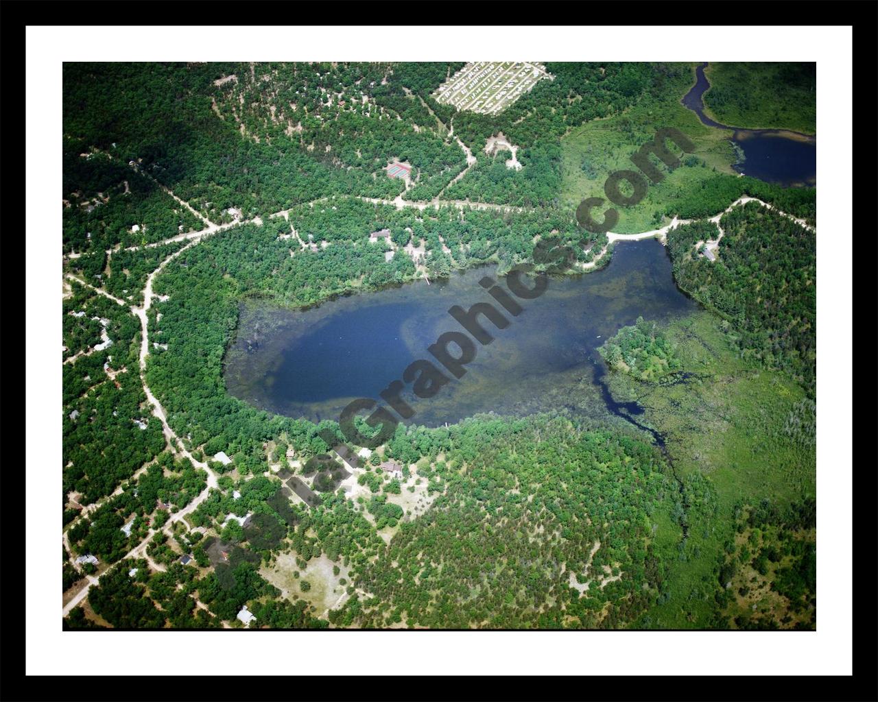 Aerial image of [5807] Wildfowl Lake in Montmorency, MI with Black Metal frame