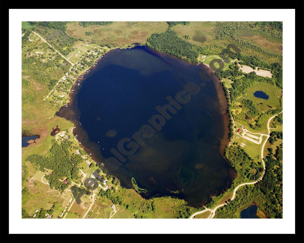 Aerial image of [5815] Independence Lake in Washtenaw, MI with Black Metal frame