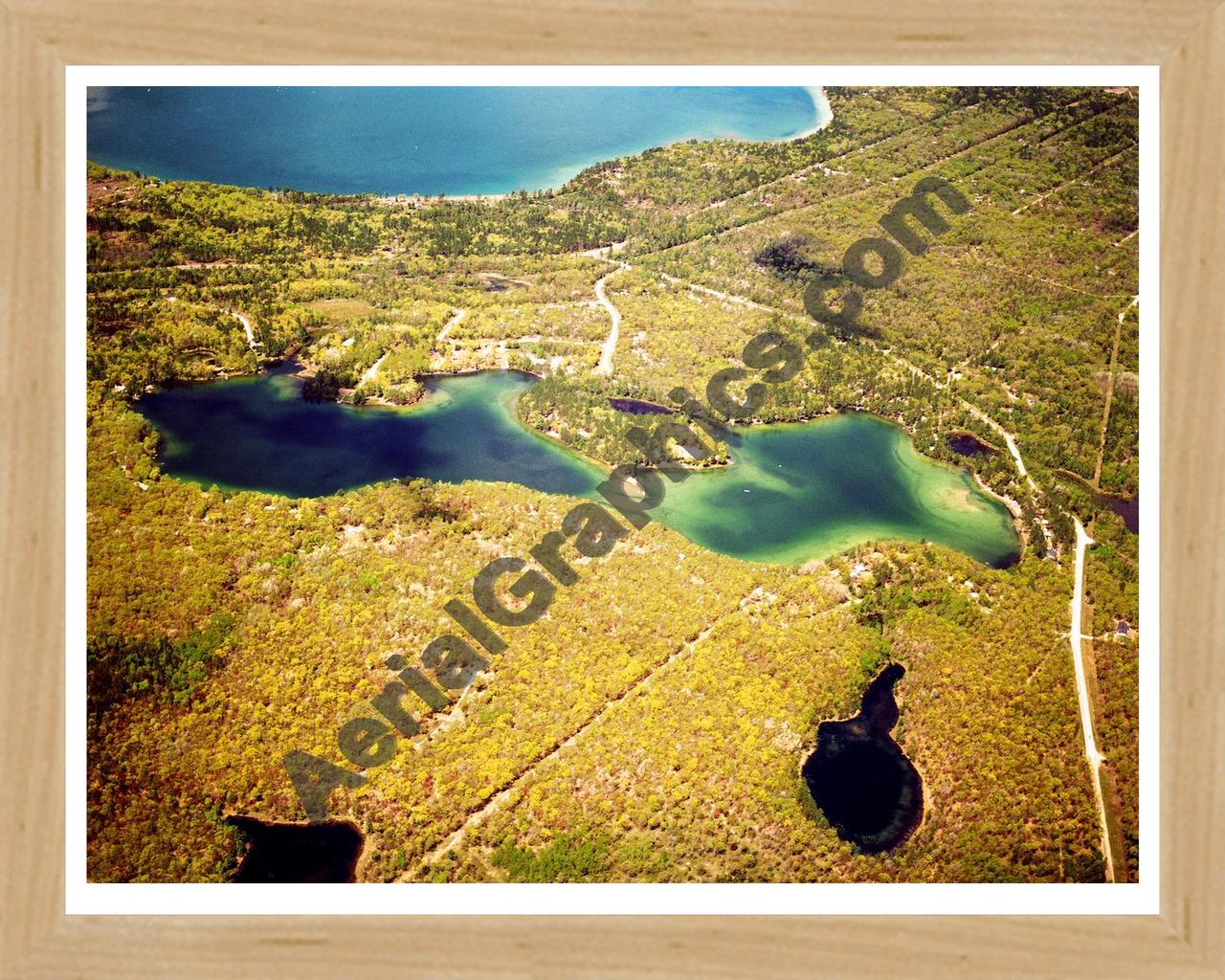 Aerial image of [5843] Little Wolf Lake in Montmorency, MI with Natural Wood frame