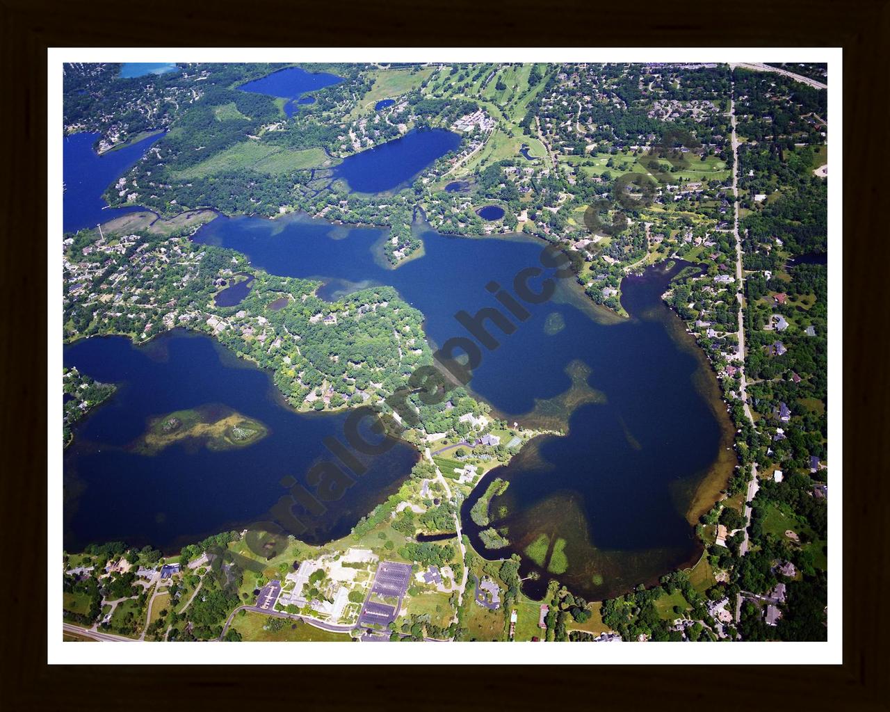 Aerial image of [5851] Lower Long Lake in Oakland, MI with Black Wood frame