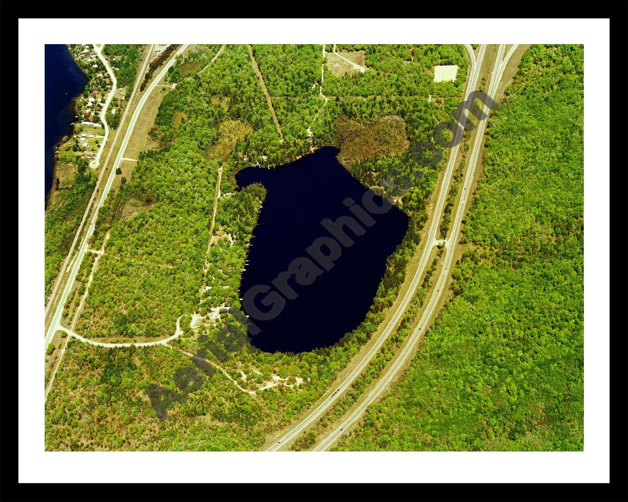 Aerial image of [5859] Lake Marjory in Otsego, MI with Black Metal frame