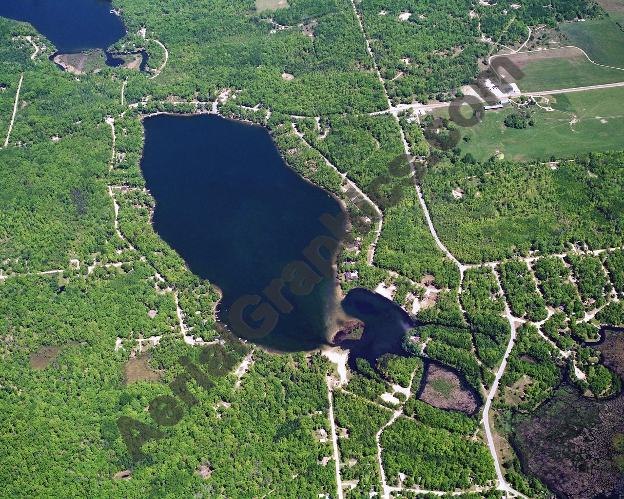 Aerial image of [5872] Arnold Lake in Clare, MI with No frame