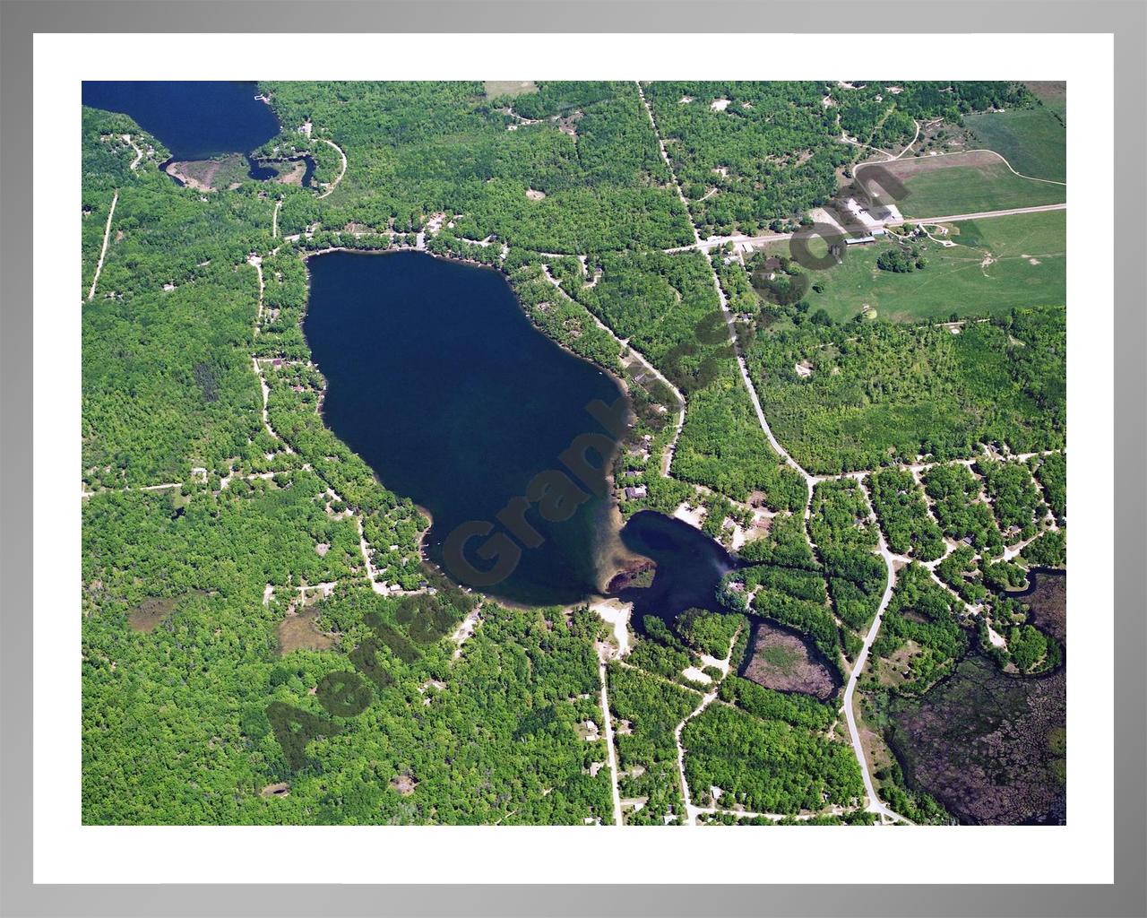 Aerial image of [5872] Arnold Lake in Clare, MI with Silver Metal frame