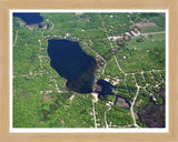 Aerial image of [5872] Arnold Lake in Clare, MI with Natural Wood frame