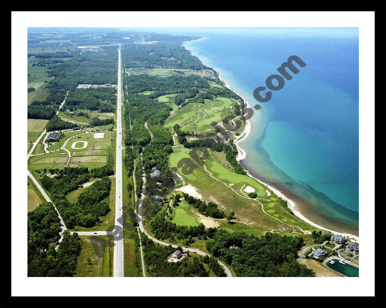 Aerial image of [5892] Bay Harbor Golf Club (Looking West) in Emmet, Mi with Black Metal frame