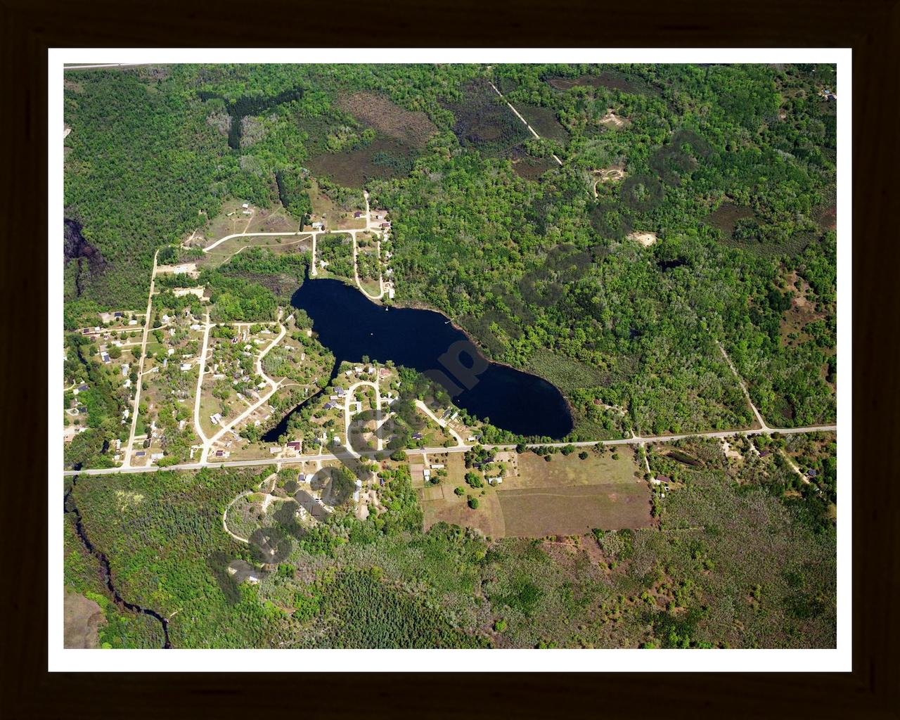 Aerial image of [602] Otter Lake in Clare, MI with Black Wood frame