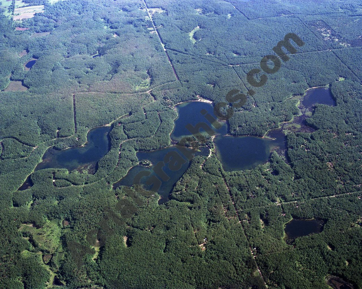 Aerial image of [607] Oxbow, Reed, Orchard, & Rainbow Lakes in Lake, MI with No frame