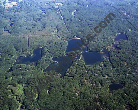 Aerial image of [607] Oxbow, Reed, Orchard, & Rainbow Lakes in Lake, MI with No frame