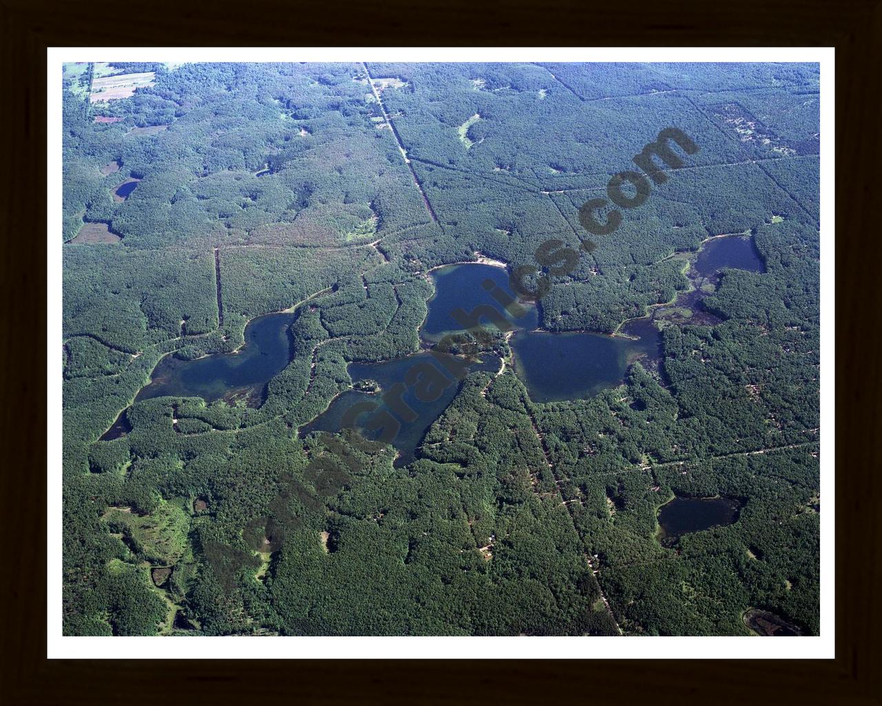 Aerial image of [607] Oxbow, Reed, Orchard, & Rainbow Lakes in Lake, MI with Black Wood frame