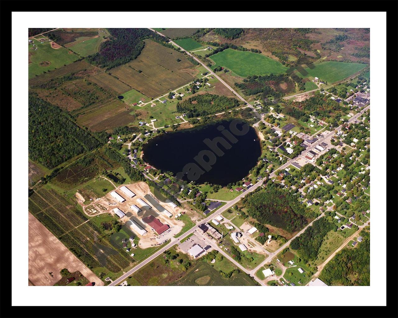 Aerial image of [619] Pearl Lake in Montcalm, MI with Black Metal frame