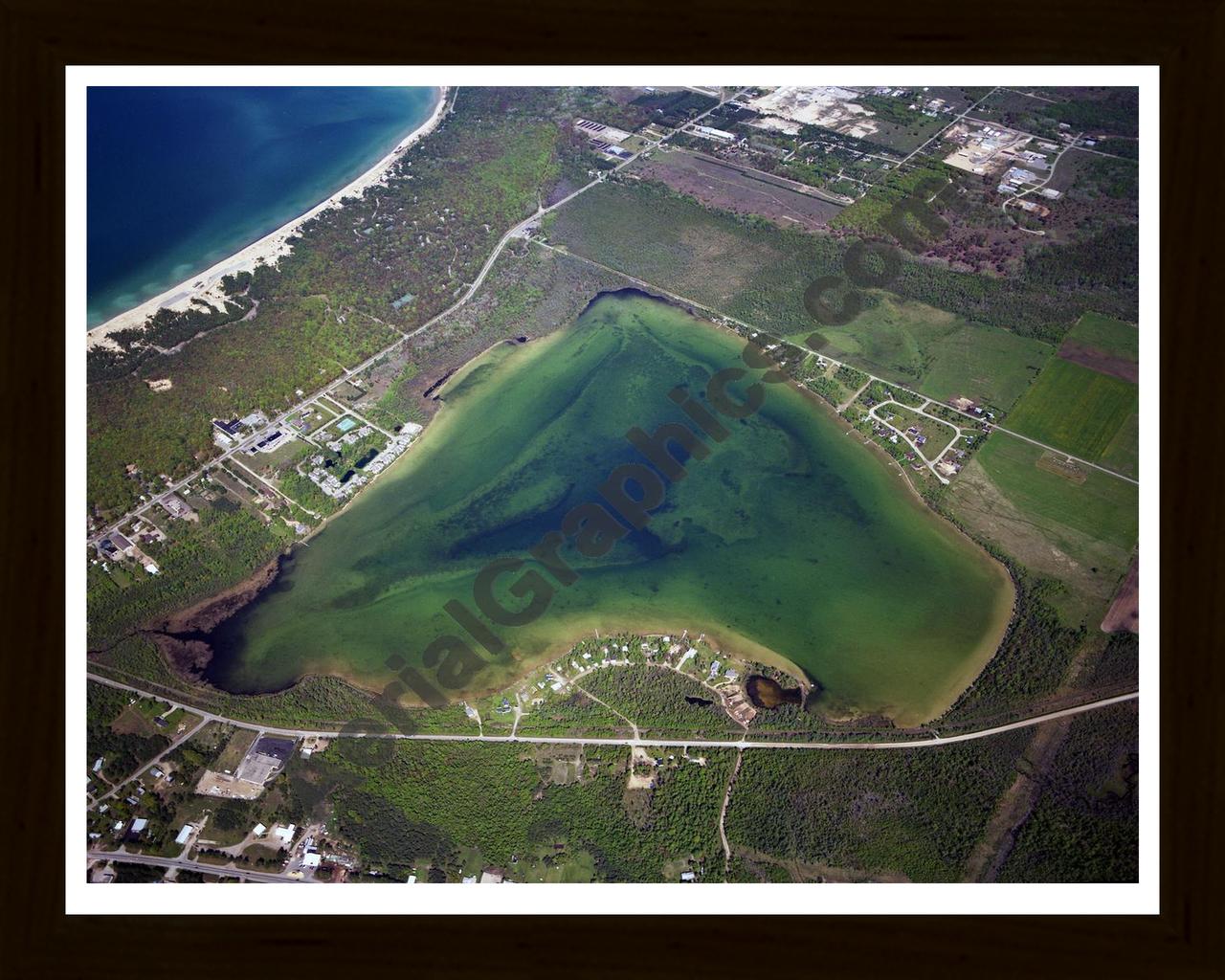 Aerial image of [672] Round Lake in Emmet, MI with Black Wood frame