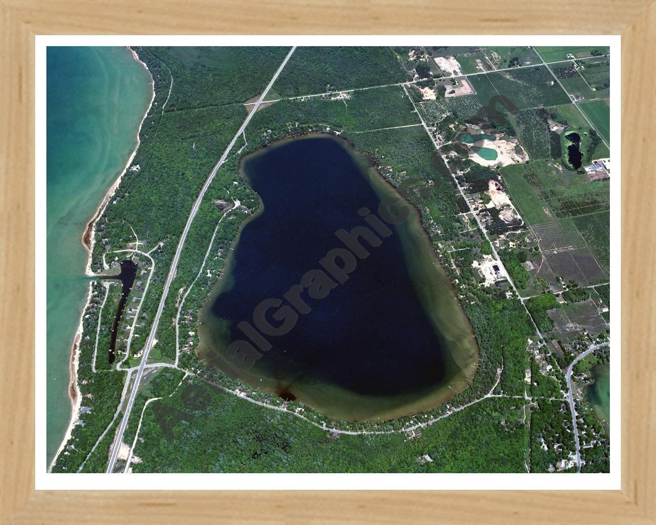 Aerial image of [85] Birch Lake in Antrim, MI with Natural Wood frame