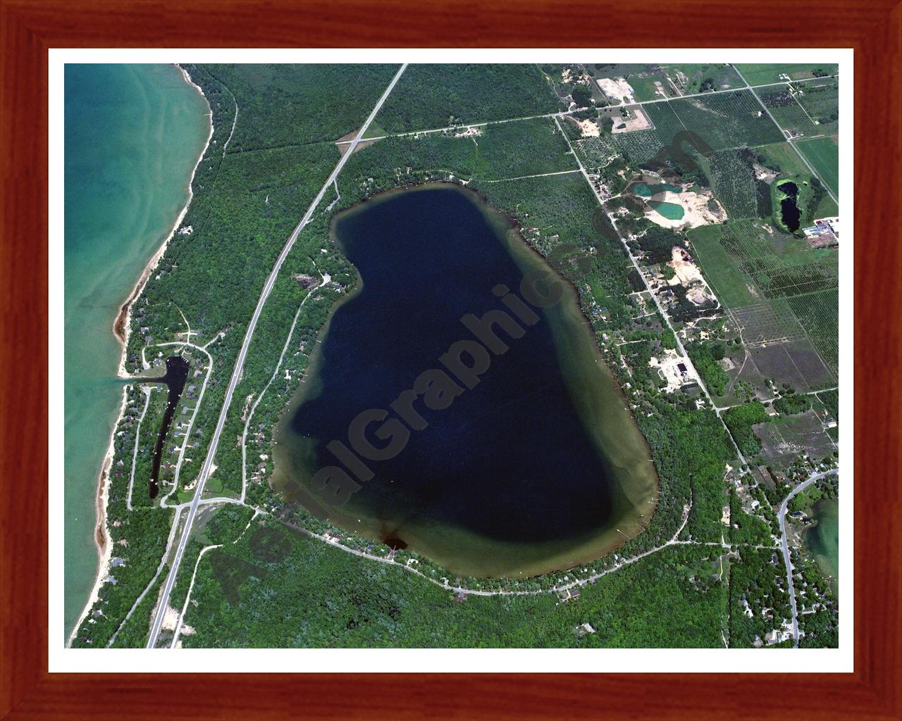 Aerial image of [85] Birch Lake in Antrim, MI with Cherry Wood frame