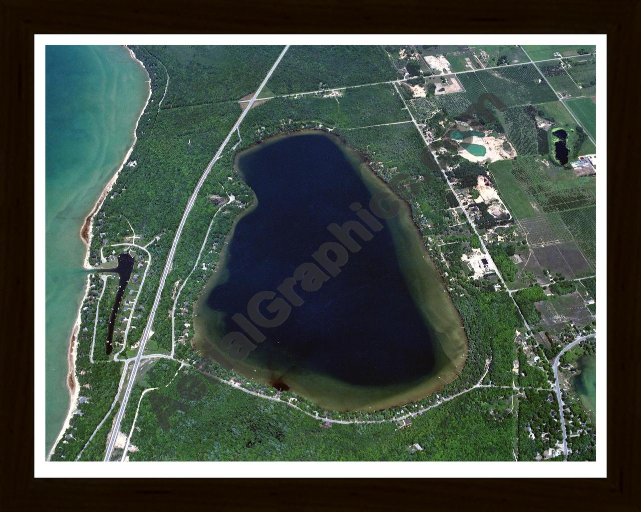 Aerial image of [85] Birch Lake in Antrim, MI with Black Wood frame